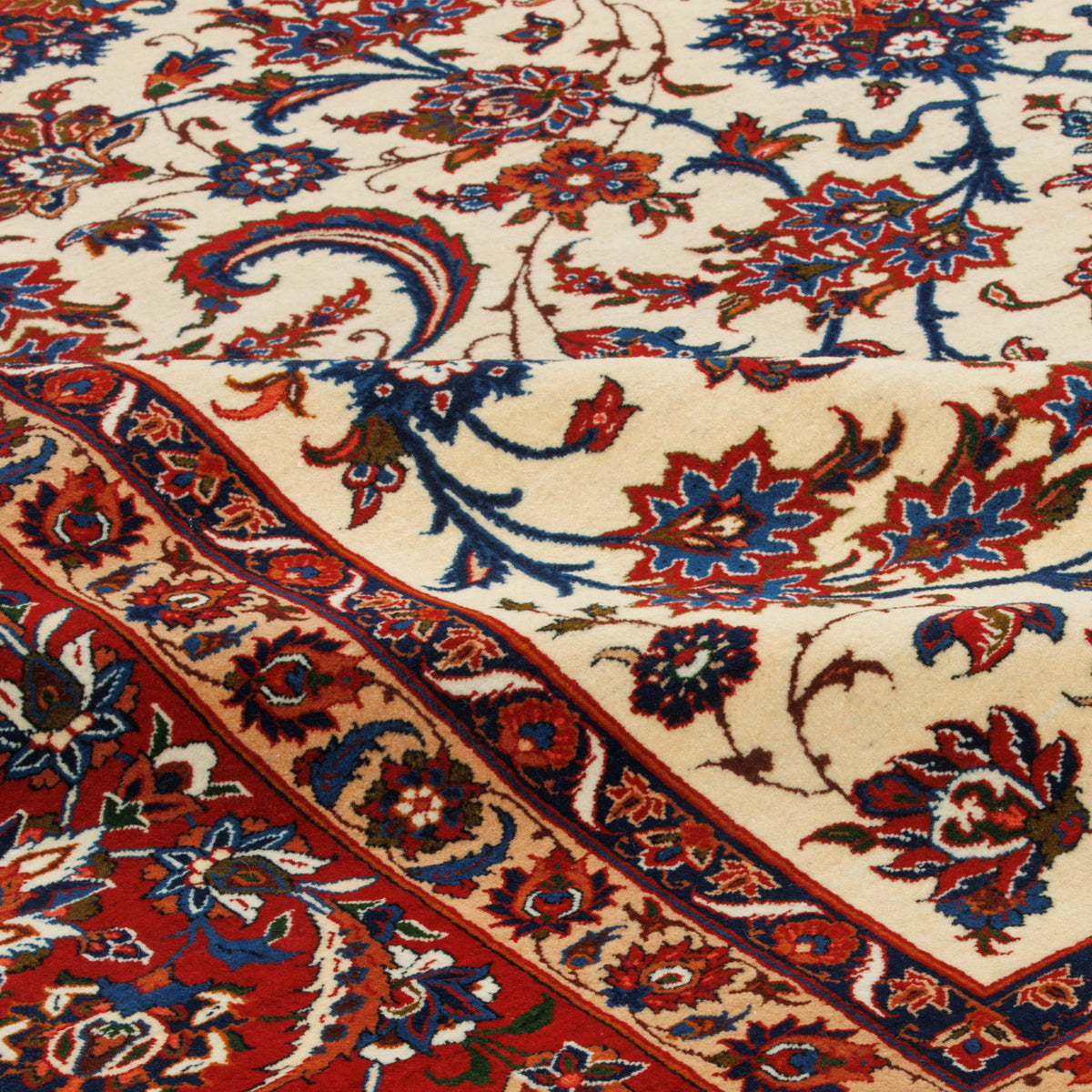 Close-up of an Isfahan handmade carpet showing the pile and border